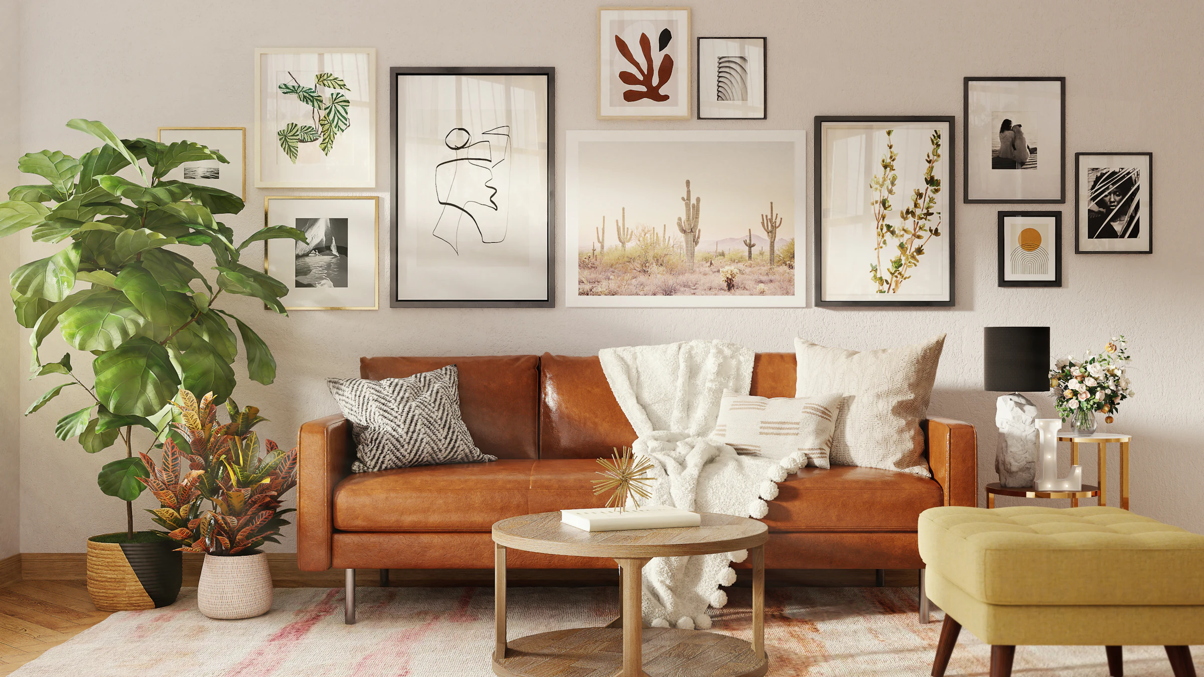 Living room with a tan leather sofa, a gallery wall and warm lamps